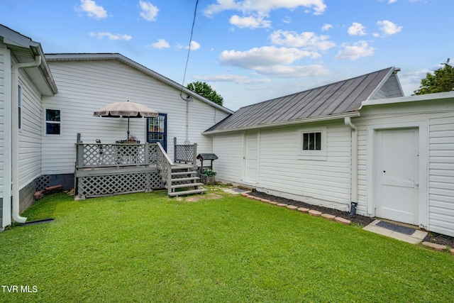 1634 Highland St, Kingsport, TN 37664 - back of house featuring a lawn, a metal roof, and a deck