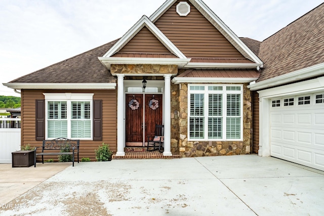 1124 Martingale Sq, Kingsport, TN 37663 - view of front of house featuring stone siding, roof with shingles, driveway, and an attached garage