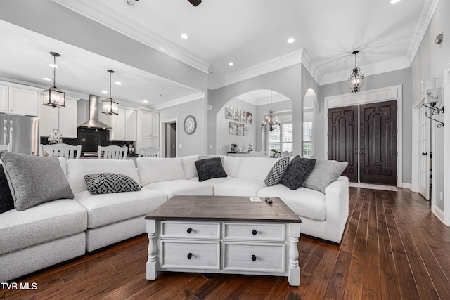 1124 Martingale Sq, Kingsport, TN 37663 - living room featuring a chandelier, arched walkways, recessed lighting, dark wood-style floors, and crown molding