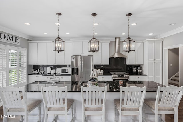 1124 Martingale Sq, Kingsport, TN 37663 - kitchen with wall chimney exhaust hood, appliances with stainless steel finishes, tasteful backsplash, white cabinetry, and ornamental molding