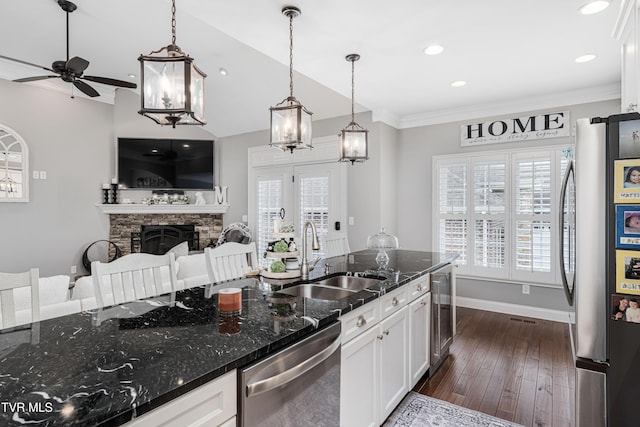 1124 Martingale Sq, Kingsport, TN 37663 - kitchen featuring appliances with stainless steel finishes, ceiling fan, white cabinets, wine cooler, and dark stone counters