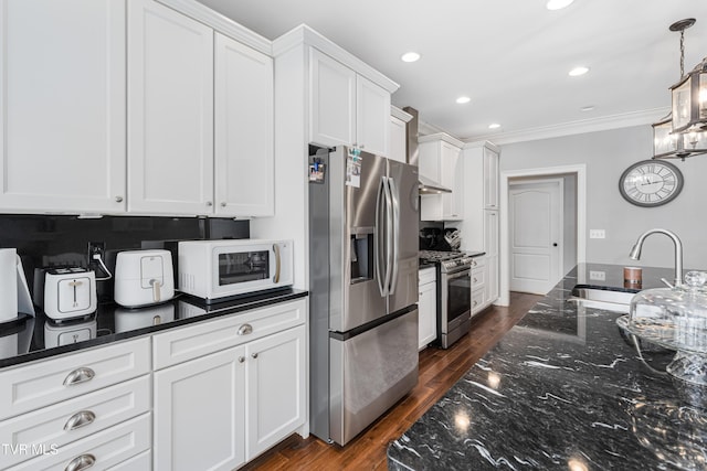 1124 Martingale Sq, Kingsport, TN 37663 - kitchen with stainless steel appliances, crown molding, white cabinetry, dark stone counters, and recessed lighting
