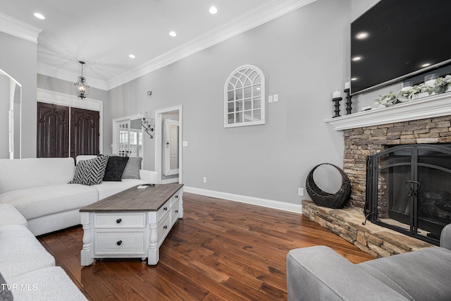 1124 Martingale Sq, Kingsport, TN 37663 - living area with ornamental molding, dark wood finished floors, a stone fireplace, recessed lighting, and a chandelier