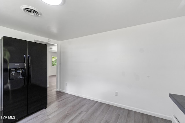 265 Hightop Rd, Midway, TN 37809 - kitchen featuring black fridge with ice dispenser and light wood-style flooring