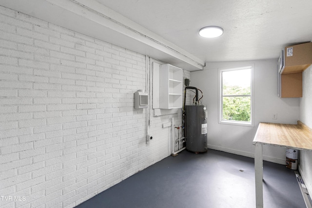 265 Hightop Rd, Midway, TN 37809 - below grade area featuring electric water heater and brick wall