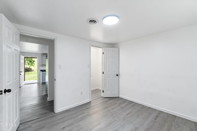 265 Hightop Rd, Midway, TN 37809 - unfurnished bedroom featuring wood finished floors and a fireplace