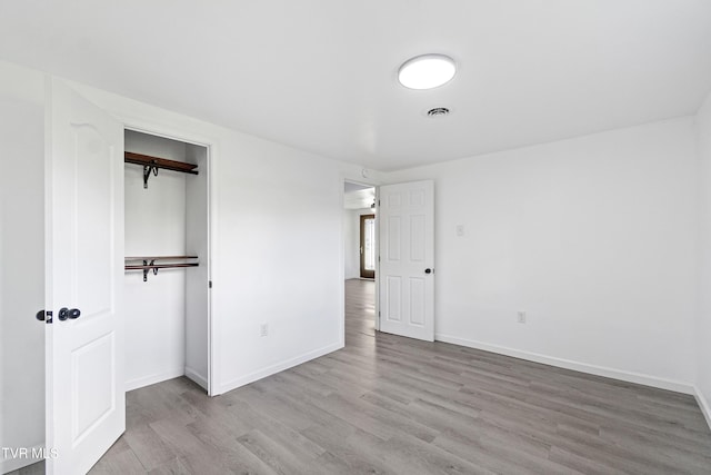 265 Hightop Rd, Midway, TN 37809 - unfurnished bedroom featuring wood finished floors and a closet