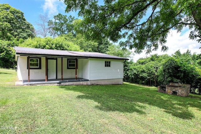 265 Hightop Rd, Midway, TN 37809 - view of front of house with a front yard, covered porch, and a metal roof