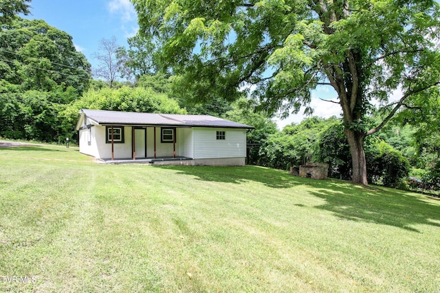 265 Hightop Rd, Midway, TN 37809 - rear view of property featuring a yard, covered porch, and view of scattered trees