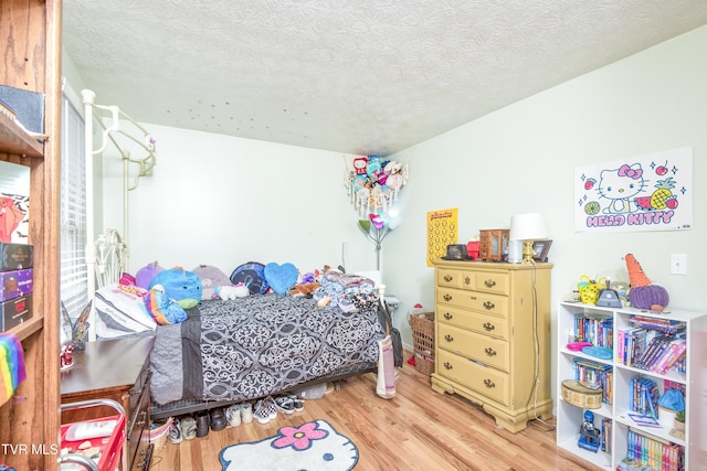 817 NE Wayne Ave Unit 817, Abingdon, VA 24210 - bedroom featuring wood finished floors and a textured ceiling
