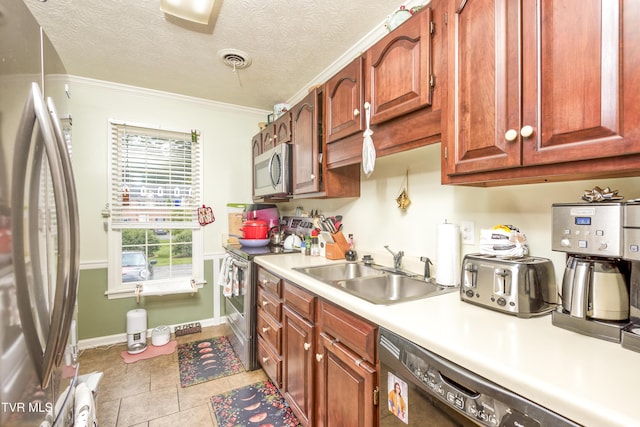 817 NE Wayne Ave Unit 817, Abingdon, VA 24210 - kitchen featuring stainless steel appliances, light countertops, light tile patterned floors, and crown molding