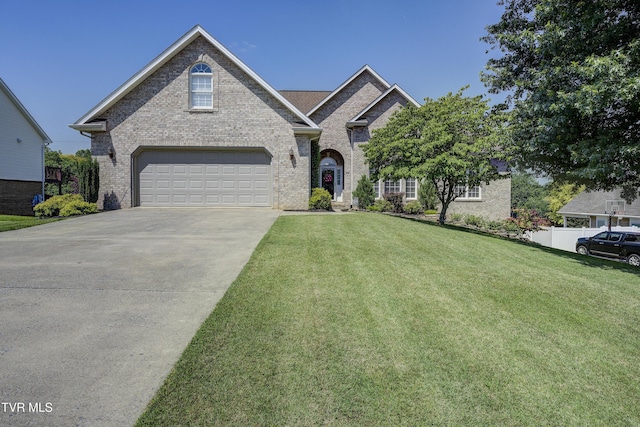 305 Emerald Chase Cir, Johnson City, TN 37615 - view of front of home featuring concrete driveway, a front lawn, and brick siding