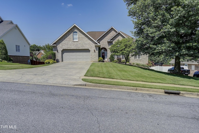 305 Emerald Chase Cir, Johnson City, TN 37615 - traditional-style home with driveway, brick siding, and an attached garage