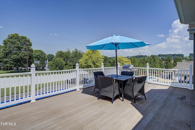 305 Emerald Chase Cir, Johnson City, TN 37615 - wooden terrace featuring outdoor dining space, view of wooded area, and a grill