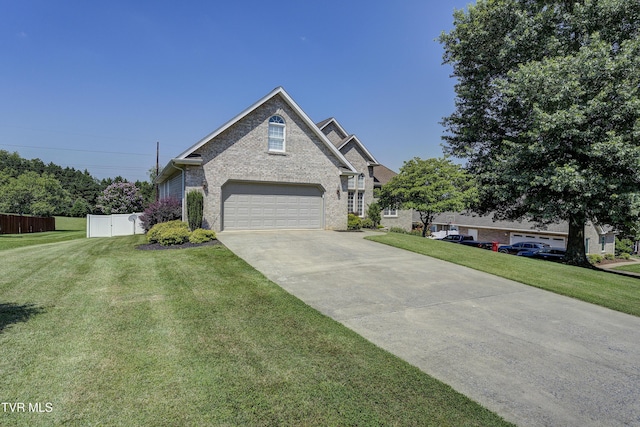 305 Emerald Chase Cir, Johnson City, TN 37615 - traditional-style house featuring concrete driveway, a garage, and brick siding