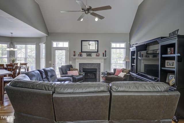 305 Emerald Chase Cir, Johnson City, TN 37615 - living area with a fireplace, ceiling fan, wood finished floors, high vaulted ceiling, and a chandelier