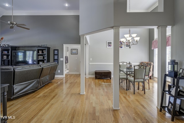 305 Emerald Chase Cir, Johnson City, TN 37615 - dining area featuring high vaulted ceiling, ceiling fan, a chandelier, light wood-style floors, and ornate columns