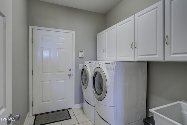305 Emerald Chase Cir, Johnson City, TN 37615 - washroom featuring cabinet space, washing machine and dryer, and light tile patterned flooring
