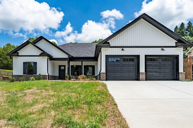 1308 Walnut Grove Rd, Jonesborough, TN 37659 - modern inspired farmhouse with a garage, concrete driveway, brick siding, and a front yard