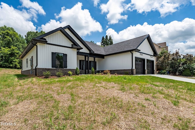 1308 Walnut Grove Rd, Jonesborough, TN 37659 - modern inspired farmhouse with an attached garage, brick siding, driveway, and a front lawn
