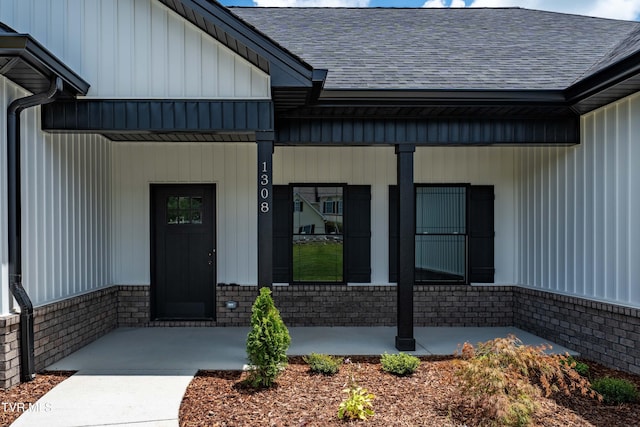 1308 Walnut Grove Rd, Jonesborough, TN 37659 - doorway to property featuring covered porch, roof with shingles, and brick siding