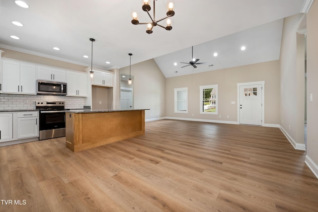 1308 Walnut Grove Rd, Jonesborough, TN 37659 - kitchen featuring stainless steel appliances, vaulted ceiling, white cabinetry, a chandelier, and backsplash
