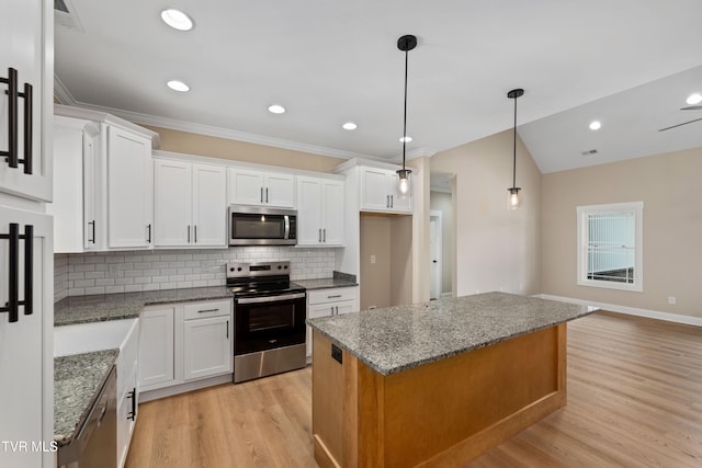 1308 Walnut Grove Rd, Jonesborough, TN 37659 - kitchen featuring stainless steel appliances, light wood-type flooring, backsplash, white cabinetry, and a center island