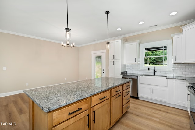 1308 Walnut Grove Rd, Jonesborough, TN 37659 - kitchen with appliances with stainless steel finishes, backsplash, light stone counters, crown molding, and a kitchen island