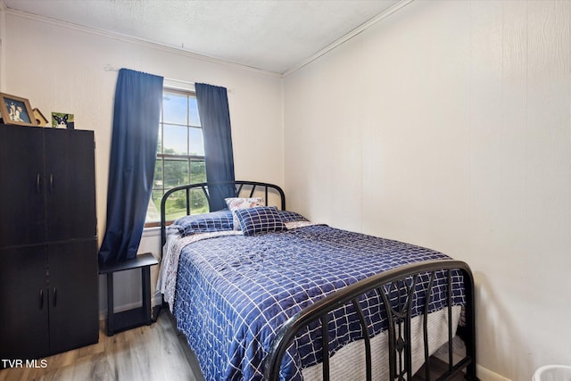 26417 Old Saltworks Rd, Abingdon, VA 24210 - bedroom with wood finished floors, crown molding, and a textured ceiling