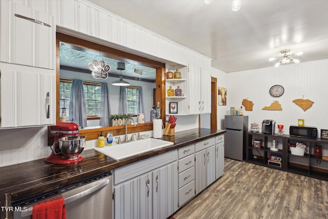 26417 Old Saltworks Rd, Abingdon, VA 24210 - kitchen with stainless steel appliances, wood finished floors, a chandelier, and open shelves