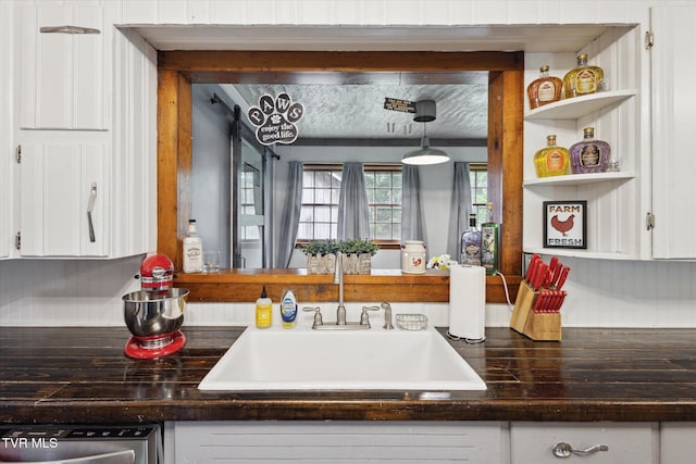 26417 Old Saltworks Rd, Abingdon, VA 24210 - kitchen with white cabinets, dark countertops, and dishwasher