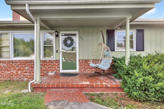 206 Cloverdale Pl, Bristol, TN 37620 - view of exterior entry featuring covered porch and brick siding