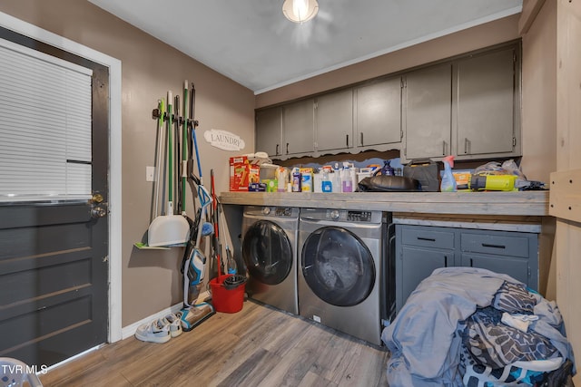206 Cloverdale Pl, Bristol, TN 37620 - washroom featuring cabinet space, washer and clothes dryer, and wood finished floors