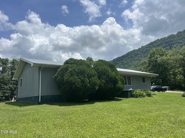 3911 Tate Springs Rd, Big Stone Gap, VA 24219 - view of property exterior with a mountain view, a lawn, and a metal roof