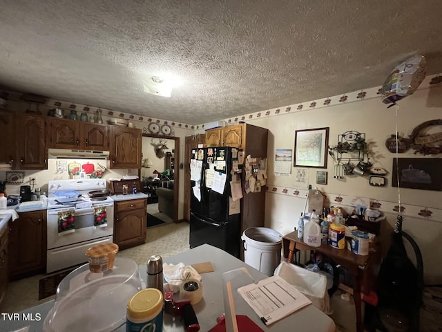 3911 Tate Springs Rd, Big Stone Gap, VA 24219 - kitchen with white electric range oven, freestanding refrigerator, exhaust hood, a textured ceiling, and light countertops