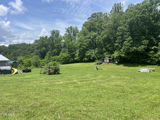 3911 Tate Springs Rd, Big Stone Gap, VA 24219 - view of green lawn featuring a forest view and a playground
