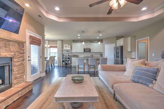 3309 Murrayfield Way, Kingsport, TN 37664 - living room featuring a tray ceiling, recessed lighting, ornamental molding, dark wood-style floors, and ceiling fan