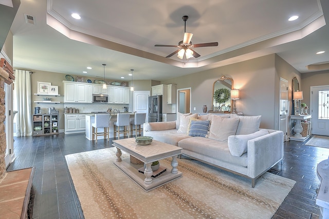 3309 Murrayfield Way, Kingsport, TN 37664 - living room featuring a tray ceiling, dark wood-style flooring, recessed lighting, crown molding, and ceiling fan