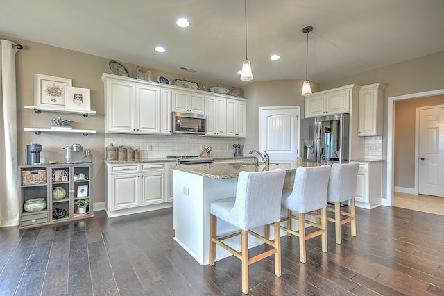 3309 Murrayfield Way, Kingsport, TN 37664 - kitchen featuring appliances with stainless steel finishes, dark wood-style flooring, recessed lighting, decorative backsplash, and white cabinetry