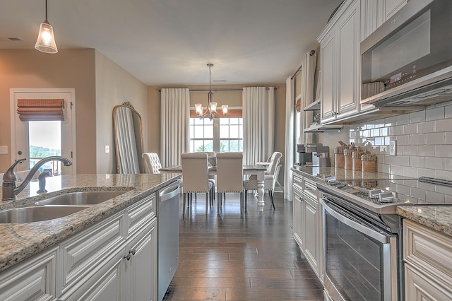 3309 Murrayfield Way, Kingsport, TN 37664 - kitchen featuring stainless steel appliances, backsplash, a chandelier, white cabinetry, and dark wood-style flooring