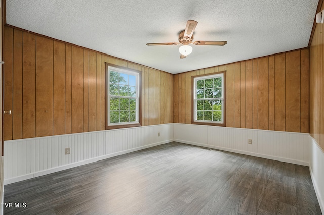 271 Anderson St, Pennington Gap, VA 24277 - empty room with dark wood-type flooring, ceiling fan, and a textured ceiling