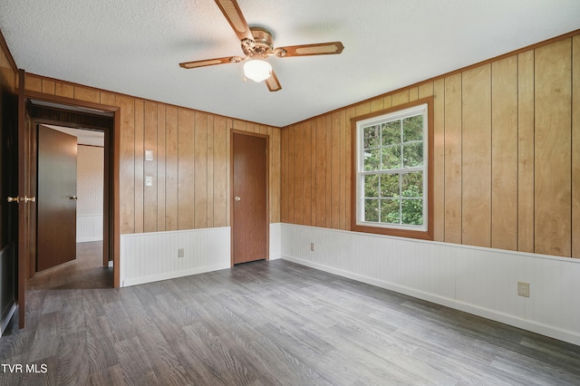 271 Anderson St, Pennington Gap, VA 24277 - unfurnished room featuring wood finished floors, ceiling fan, and wooden walls