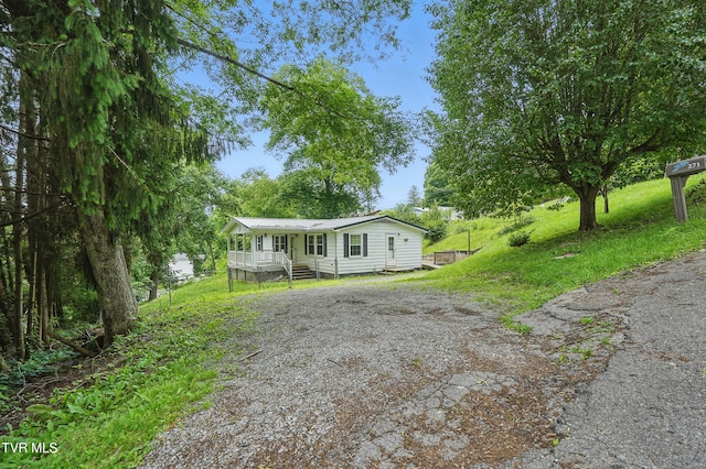 271 Anderson St, Pennington Gap, VA 24277 - manufactured / mobile home with driveway and a wooden deck
