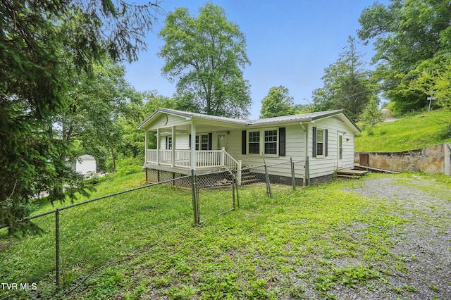 271 Anderson St, Pennington Gap, VA 24277 - view of front of property featuring a fenced backyard, a metal roof, and covered porch