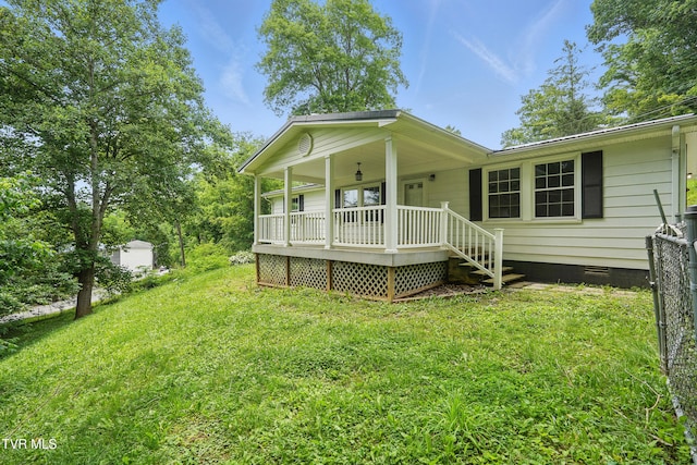 271 Anderson St, Pennington Gap, VA 24277 - view of front facade featuring crawl space, covered porch, and a front yard