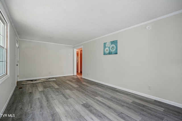 271 Anderson St, Pennington Gap, VA 24277 - unfurnished room with wood finished floors, ornamental molding, healthy amount of natural light, and a textured ceiling