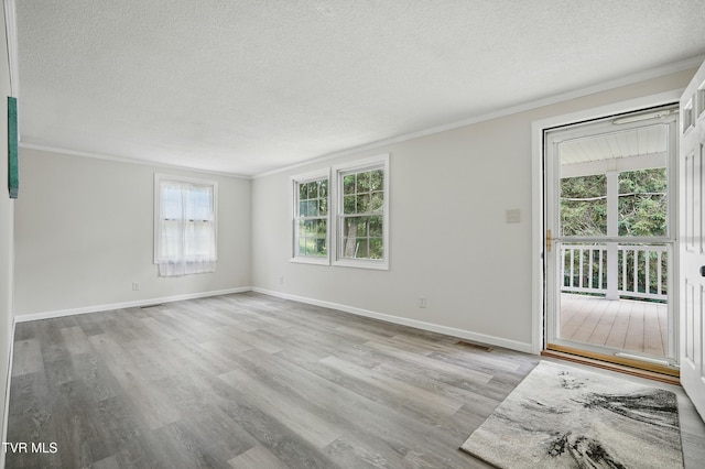 271 Anderson St, Pennington Gap, VA 24277 - unfurnished room with a textured ceiling, crown molding, and light wood-style floors