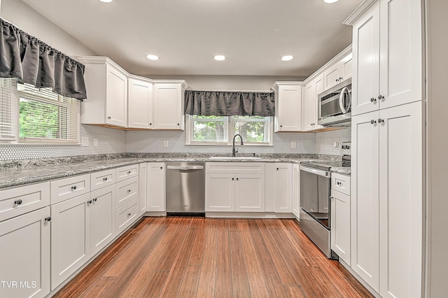 53 Grove Ave, Lebanon, VA 24266 - kitchen with appliances with stainless steel finishes, plenty of natural light, white cabinetry, and recessed lighting