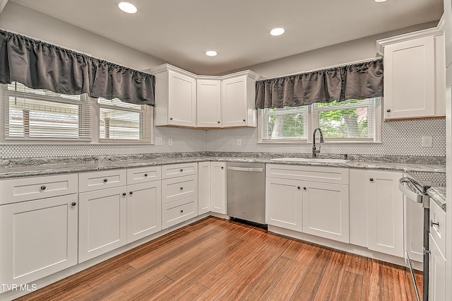 53 Grove Ave, Lebanon, VA 24266 - kitchen with stainless steel dishwasher, range, white cabinetry, light wood finished floors, and recessed lighting