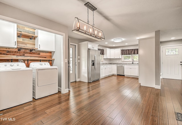 53 Grove Ave, Lebanon, VA 24266 - kitchen featuring stainless steel appliances, independent washer and dryer, white cabinetry, recessed lighting, and dark wood-style floors